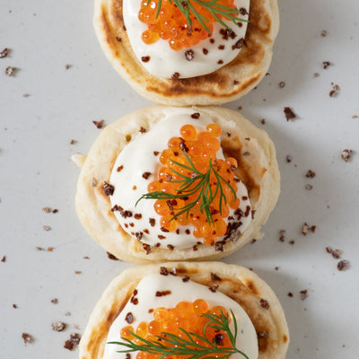 Homemade blinis, wasabi cream, and ikura